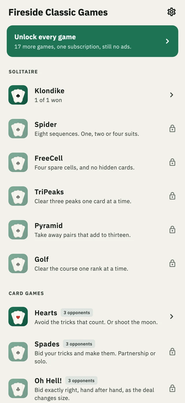 The game list, headed Fireside Classic Games. Klondike and Hearts are open; Spider, FreeCell, TriPeaks, Pyramid, Golf, Spades and Oh Hell! each show a small lock.