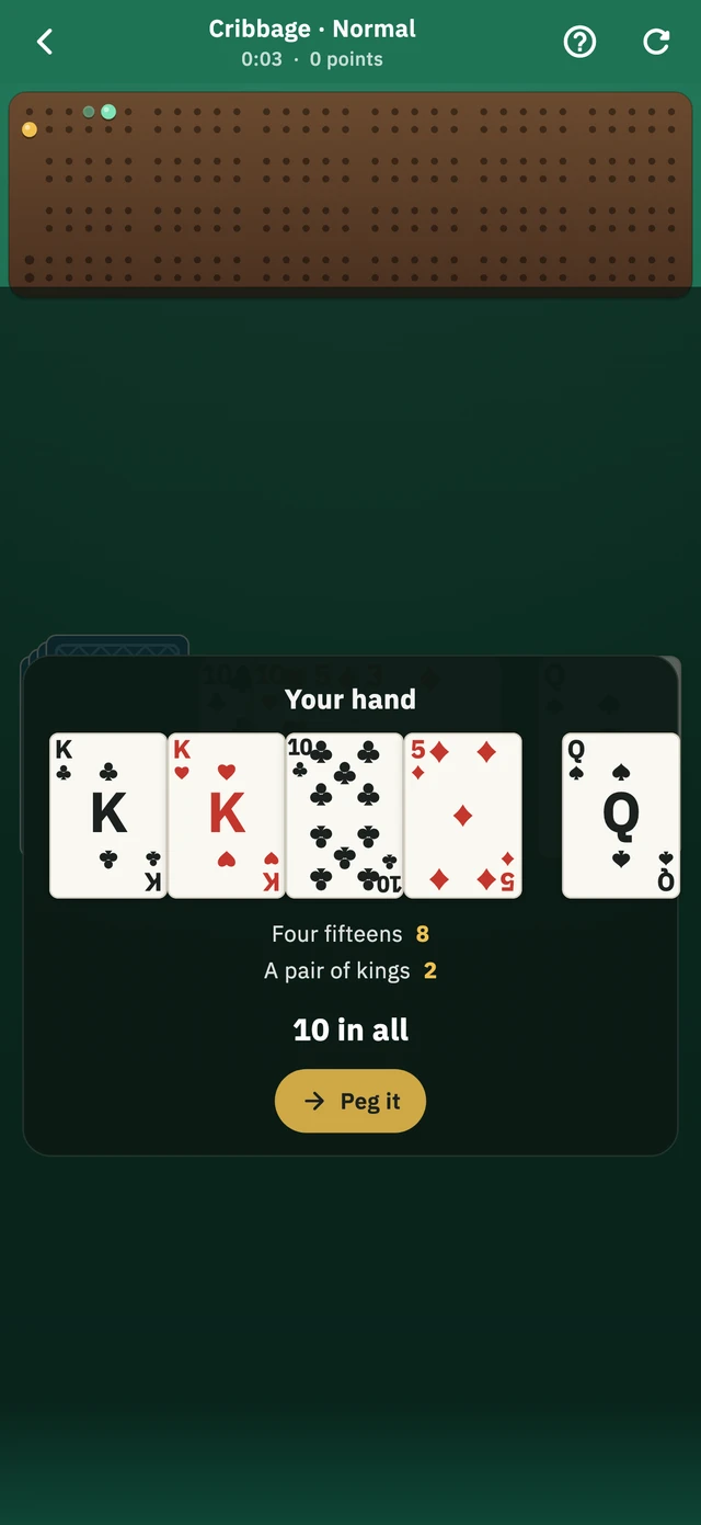 A Cribbage hand being counted below the pegging board: four fifteens for eight, a pair of kings for two, ten in all.