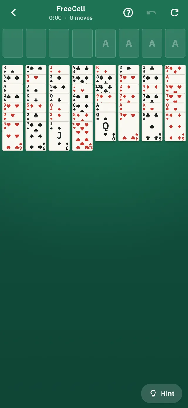 A FreeCell deal laid out across eight columns, with four free cells and four foundations above.